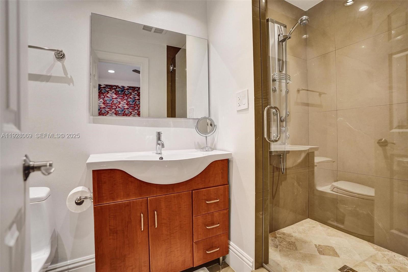 1281 Banyan Road Boca Raton, FL 33432 - Photo 39 of 69 a bathroom with a sink toilet and shower