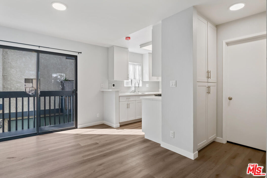 29239 Heathercliff Road, Unit 12 Malibu, CA 90265 - Photo 13 of 32 a view of a kitchen with wooden floor