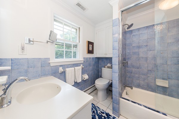 131 River Road Topsfield, MA 01983 - Photo 14 of 30 a bathroom with a sink toilet and shower