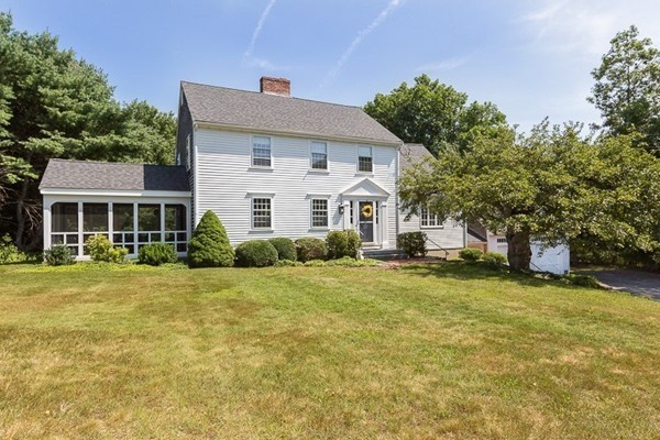131 River Road Topsfield, MA 01983 - Photo 2 of 30 a front view of a house with a garden