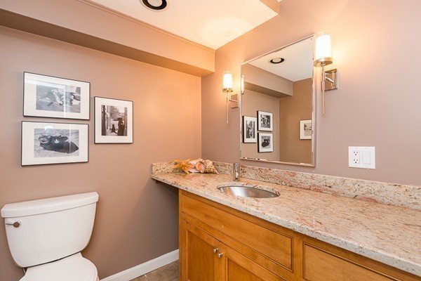 131 River Road Topsfield, MA 01983 - Photo 23 of 30 a bathroom with a granite countertop sink mirror vanity and toilet