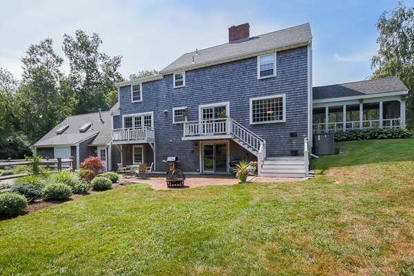 131 River Road Topsfield, MA 01983 - Photo 27 of 30 a front view of a house with garden