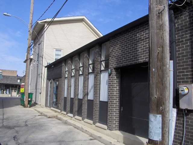 125 North Main Street Wheaton, IL 60187 - Photo 3 of 6 a front view of a building with glass door