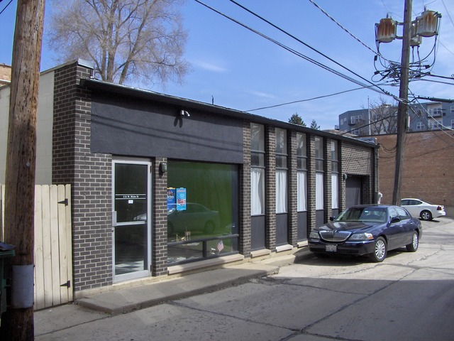 125 North Main Street Wheaton, IL 60187 - Photo 4 of 6 a car parked in front of a building