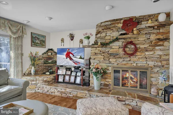 a kitchen with a stove a sink a microwave and cabinets