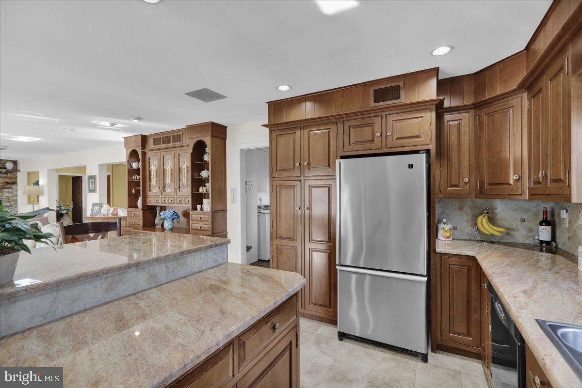 112 Grandview Boulevard Wyomissing, PA 19609 - Photo 28 of 69 a kitchen with stainless steel appliances granite countertop a refrigerator a sink and a refrigerator