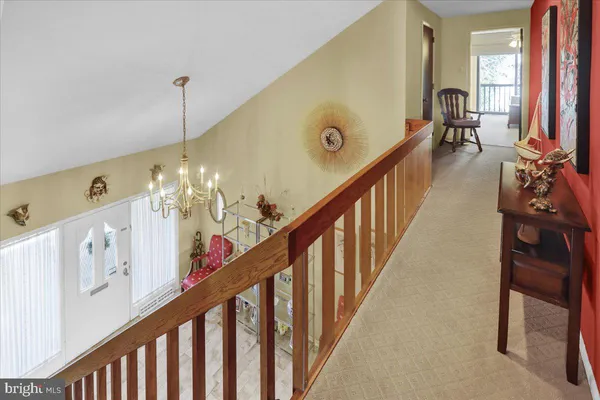 a living room with stairs and a furniture