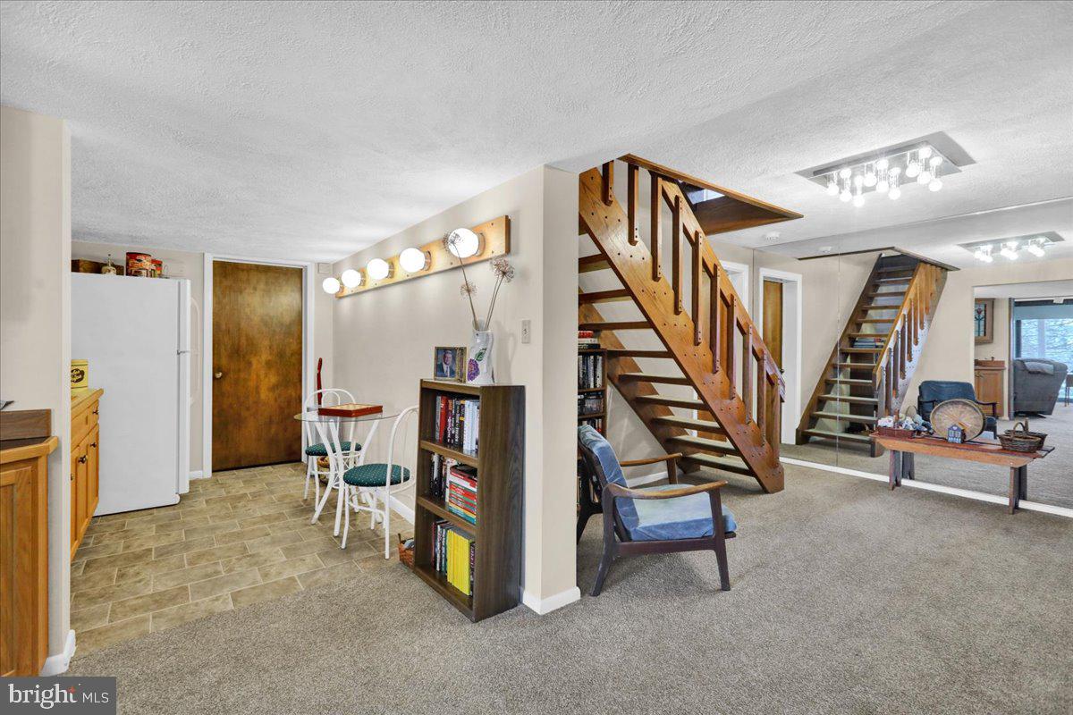 112 Grandview Boulevard Wyomissing, PA 19609 - Photo 51 of 69 a view of an empty room with stairs and furniture