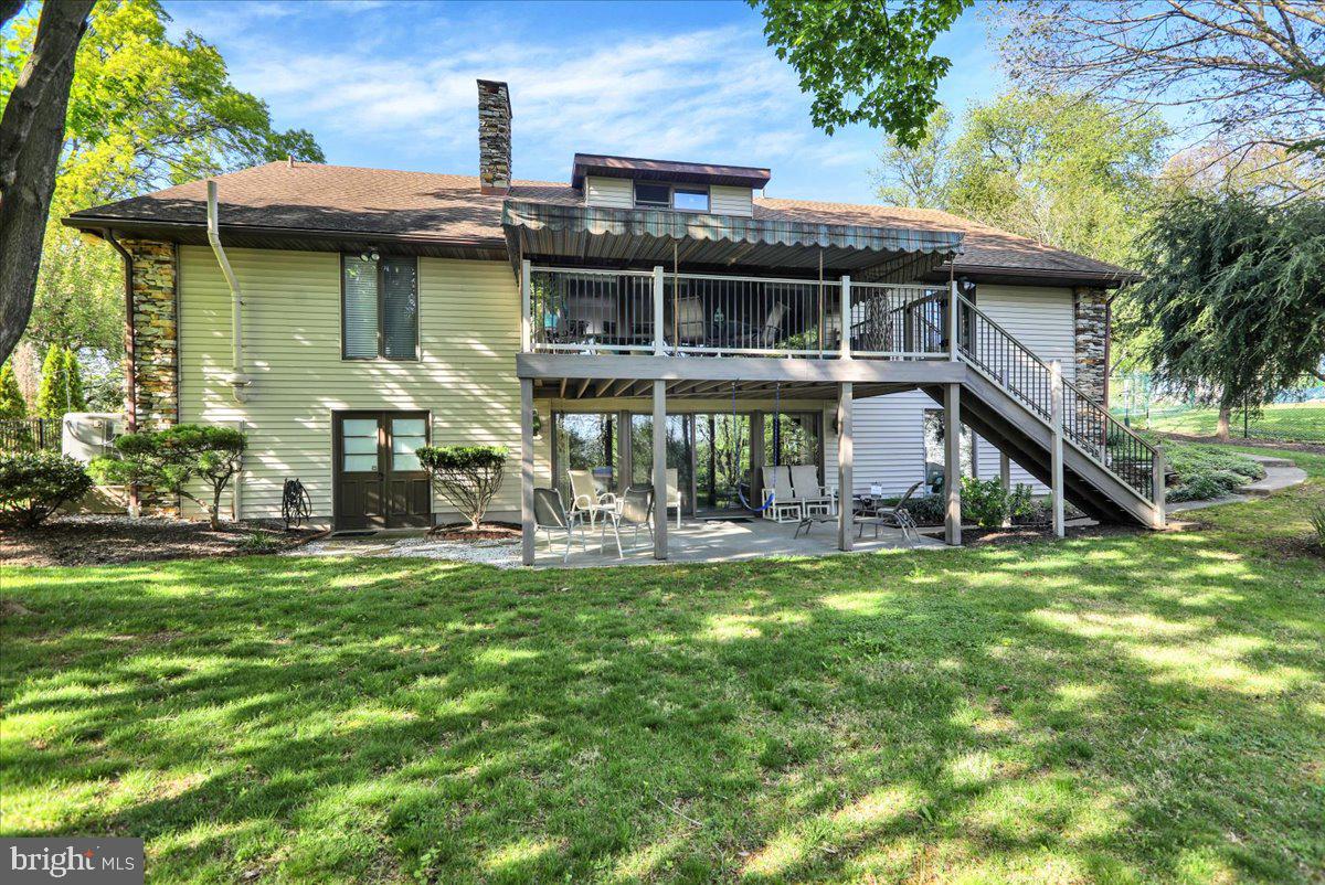 112 Grandview Boulevard Wyomissing, PA 19609 - Photo 6 of 69 a view of a house with a yard patio and deck