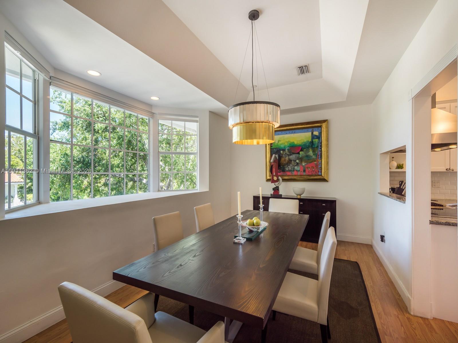 325 Pacific Road Key Biscayne, FL 33149 - Photo 15 of 31 a view of a dining room with furniture window and outside view