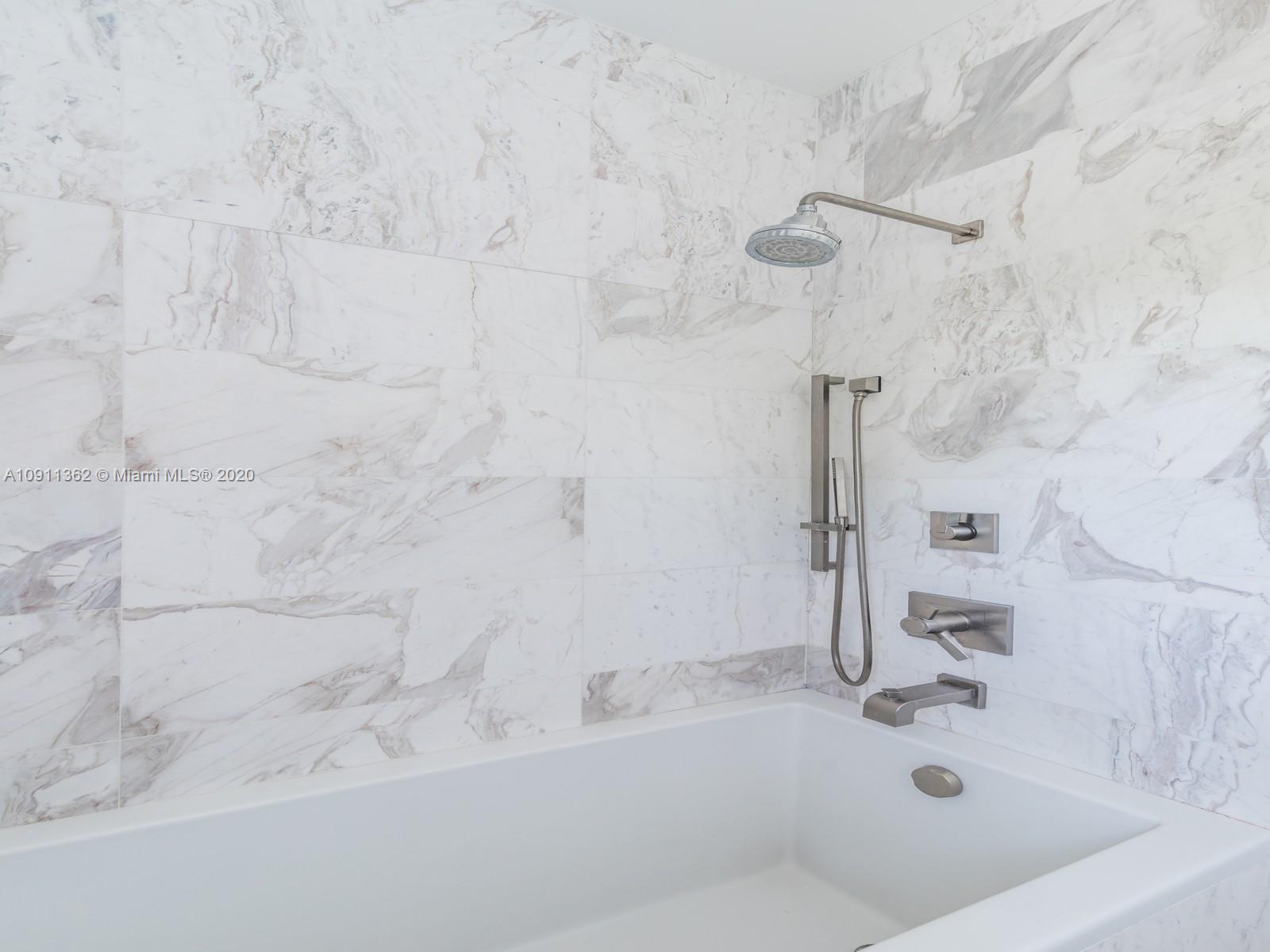 325 Pacific Road Key Biscayne, FL 33149 - Photo 22 of 31 a bathroom with a bathtub