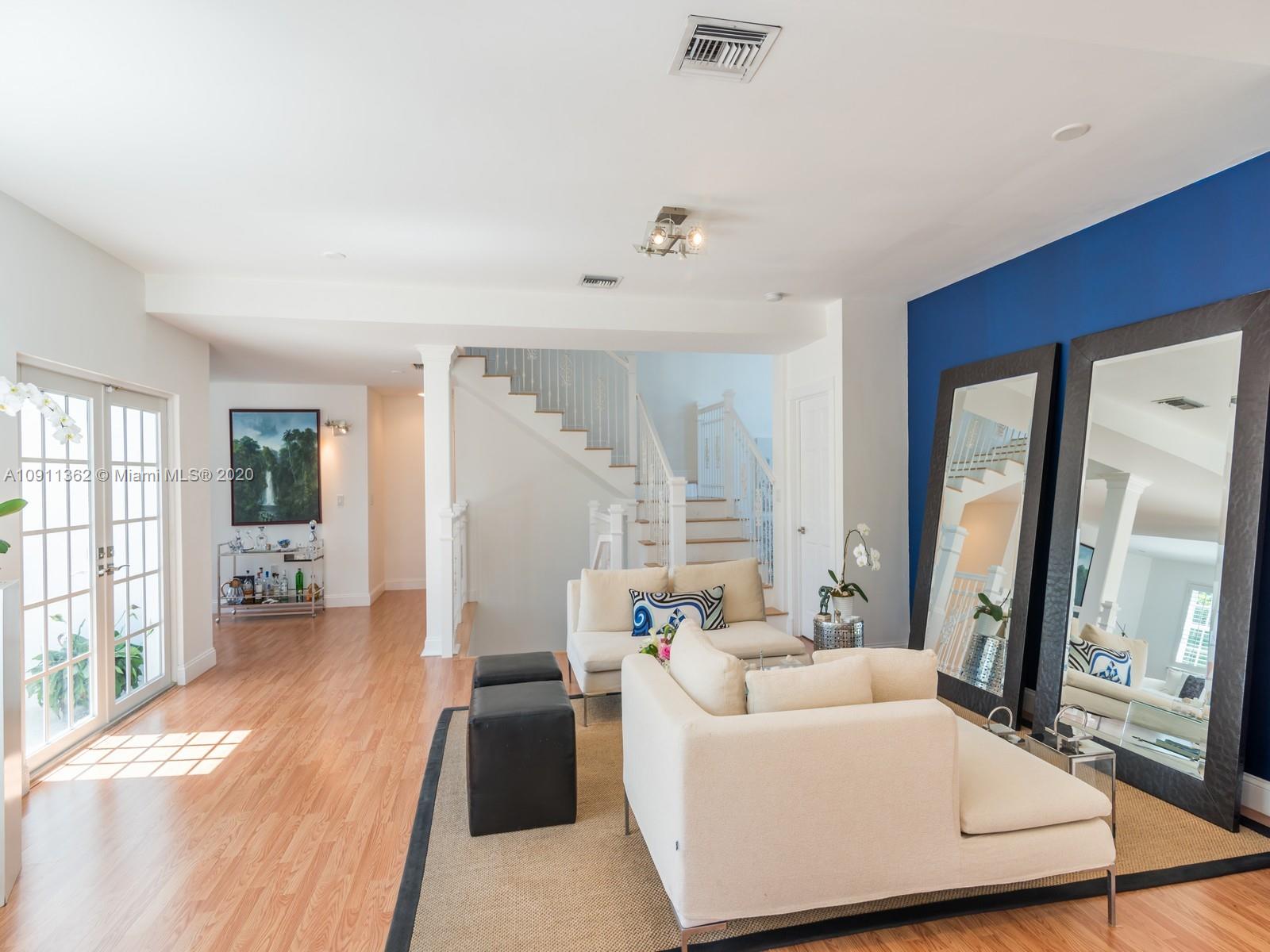 325 Pacific Road Key Biscayne, FL 33149 - Photo 4 of 31 a living room with furniture and a large window