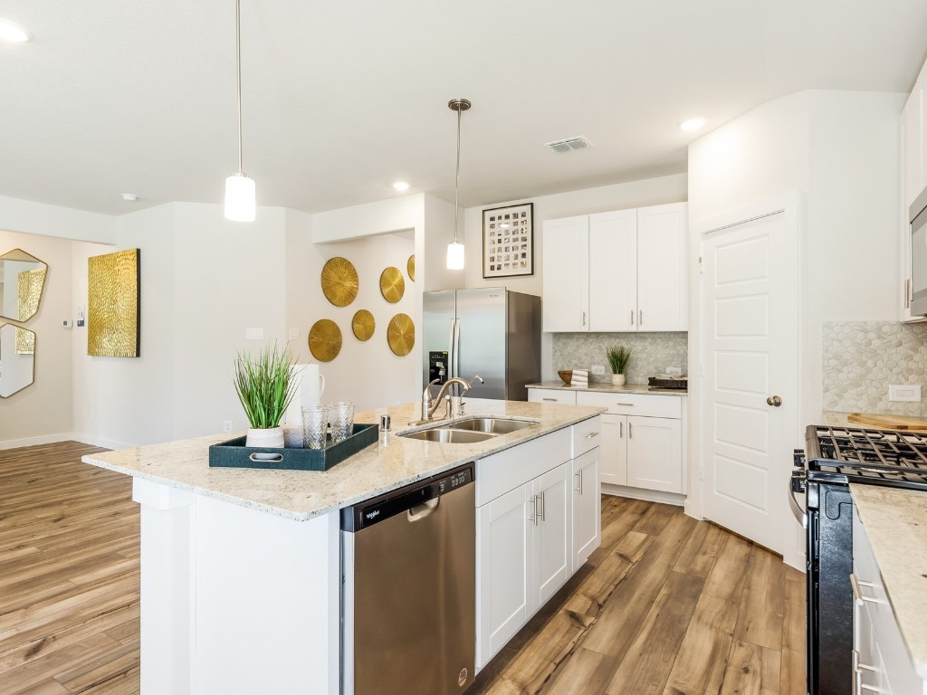 1665 Hopson Ranch Drive Conroe, TX 77301 - Photo 4 of 26 Photo is not of the actual home, but is an inspirational photo of builder’s model home and may depict options, furnishings, and/or decorator features that are not included