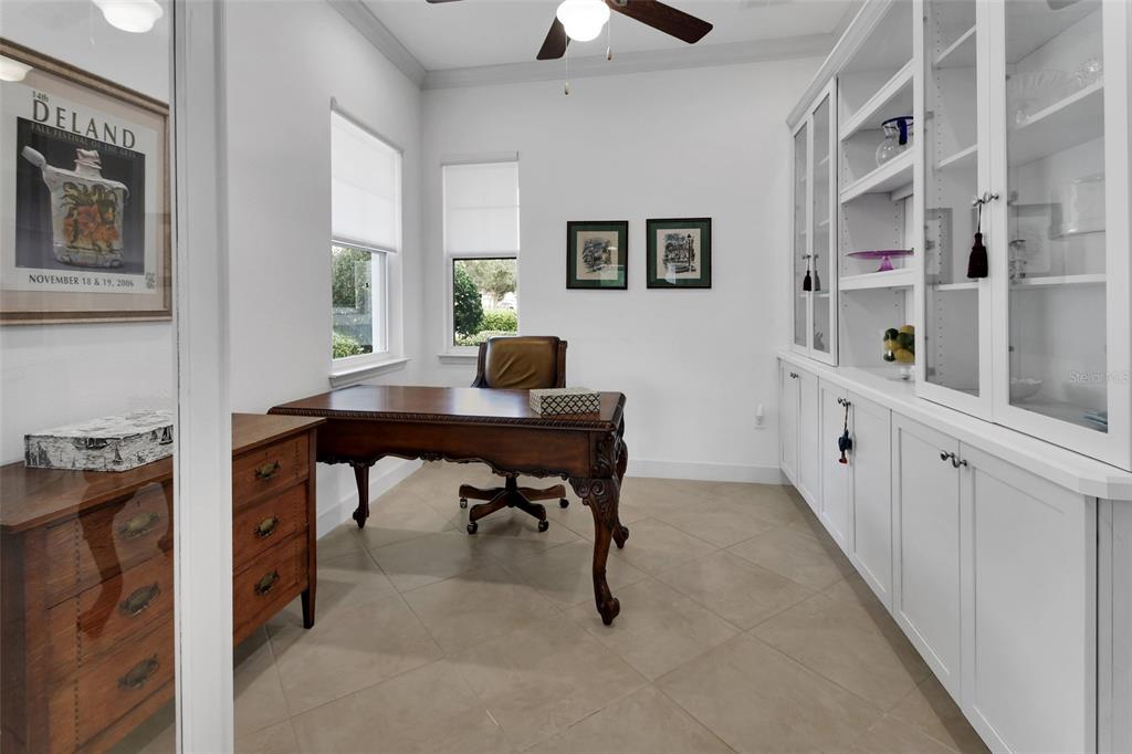 308 Locksley Court Deland, FL 32724 - Photo 11 of 56 a workspace with furniture and window