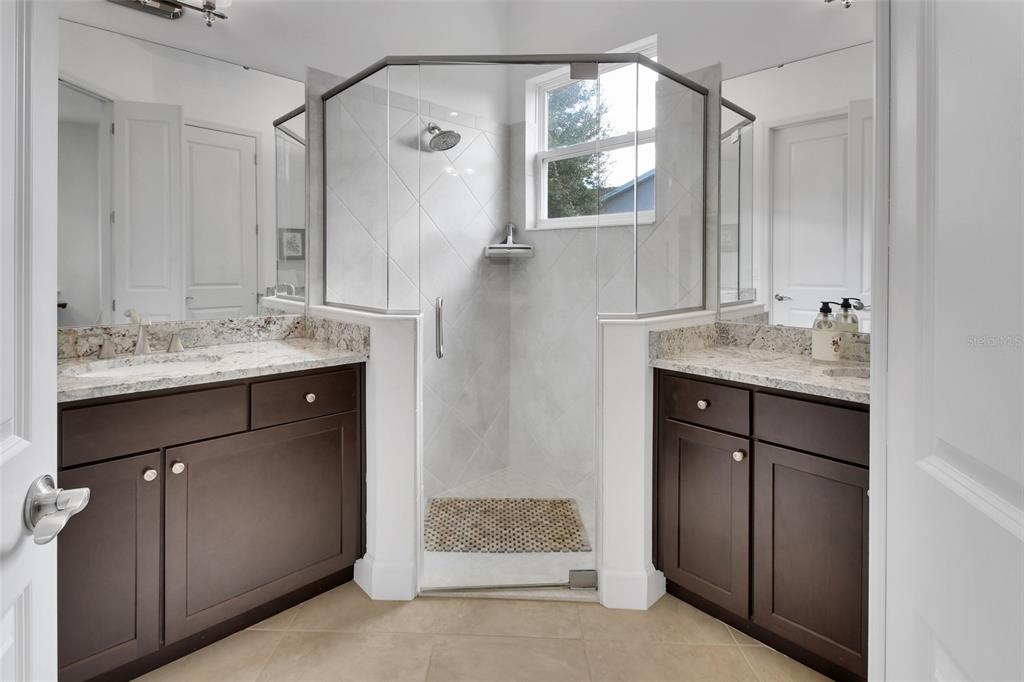 308 Locksley Court Deland, FL 32724 - Photo 16 of 56 a bathroom with a sink and a mirror