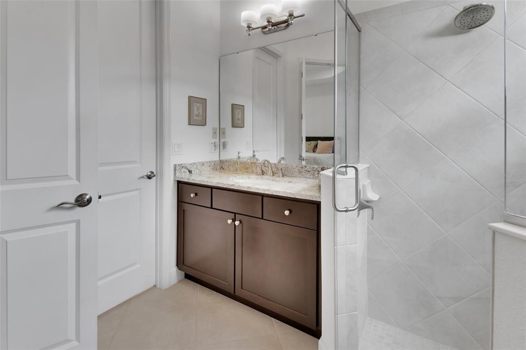 308 Locksley Court Deland, FL 32724 - Photo 18 of 56 a bathroom with a sink and a mirror