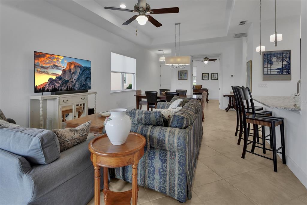 308 Locksley Court Deland, FL 32724 - Photo 4 of 56 a living room with fireplace furniture and a flat screen tv