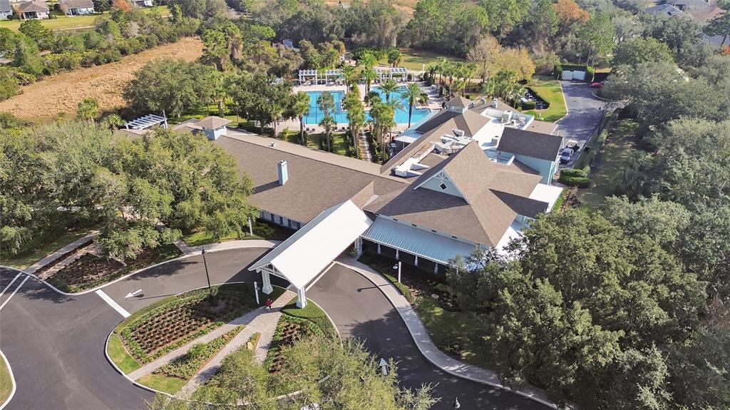 308 Locksley Court Deland, FL 32724 - Photo 50 of 56 an aerial view of a house with a yard and lake view