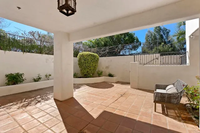 a view of a two chairs in balcony
