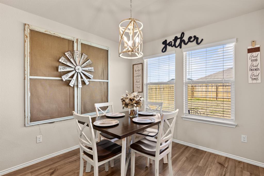 7209 Canadian Drive China Spring, TX 76633 - Photo 15 of 37 a view of a dining room with furniture window and wooden floor
