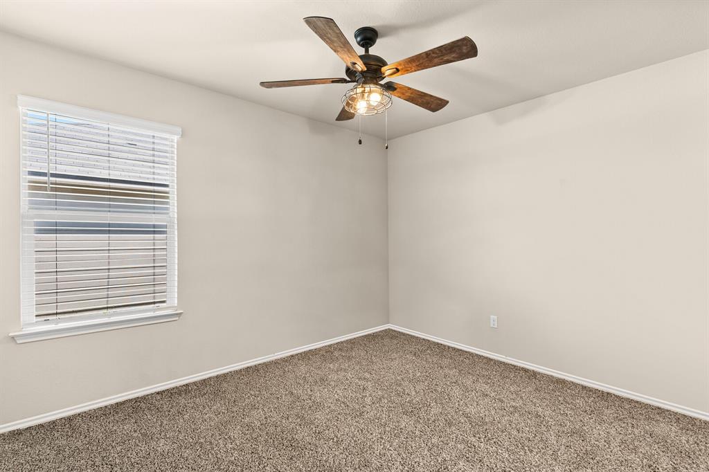 7209 Canadian Drive China Spring, TX 76633 - Photo 18 of 37 an empty room with a window and a fan