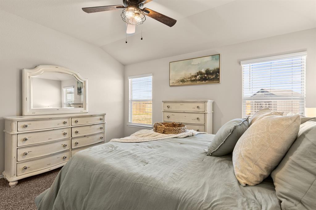 7209 Canadian Drive China Spring, TX 76633 - Photo 26 of 37 a bedroom with a bed and a chandelier