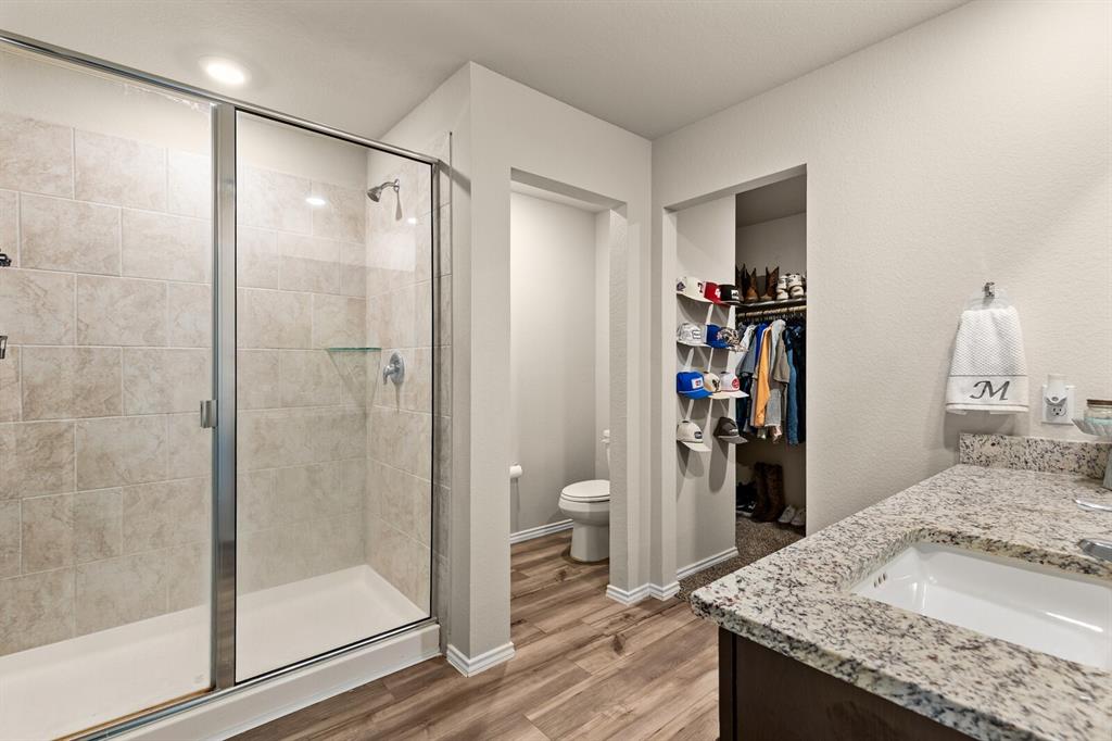 7209 Canadian Drive China Spring, TX 76633 - Photo 27 of 37 a bathroom with a granite countertop sink and a mirror