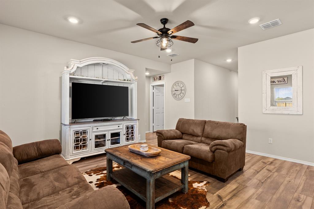 7209 Canadian Drive China Spring, TX 76633 - Photo 6 of 37 a living room with furniture and a flat screen tv
