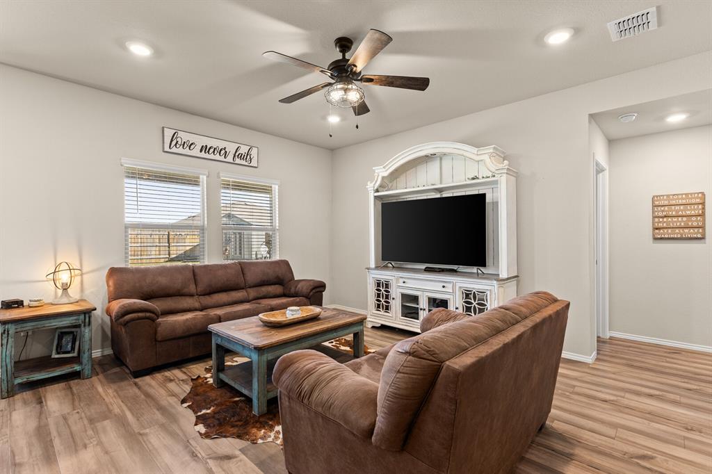 7209 Canadian Drive China Spring, TX 76633 - Photo 7 of 37 a living room with furniture and a flat screen tv