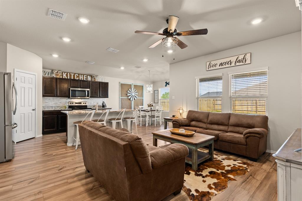 7209 Canadian Drive China Spring, TX 76633 - Photo 8 of 37 a living room with furniture kitchen and a wooden floor