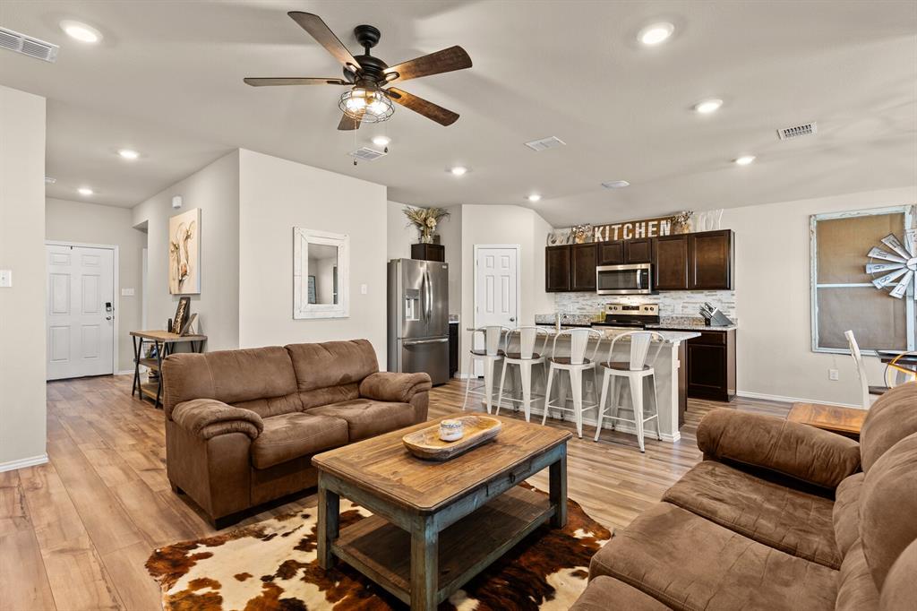 7209 Canadian Drive China Spring, TX 76633 - Photo 9 of 37 a living room with furniture and a wooden floor