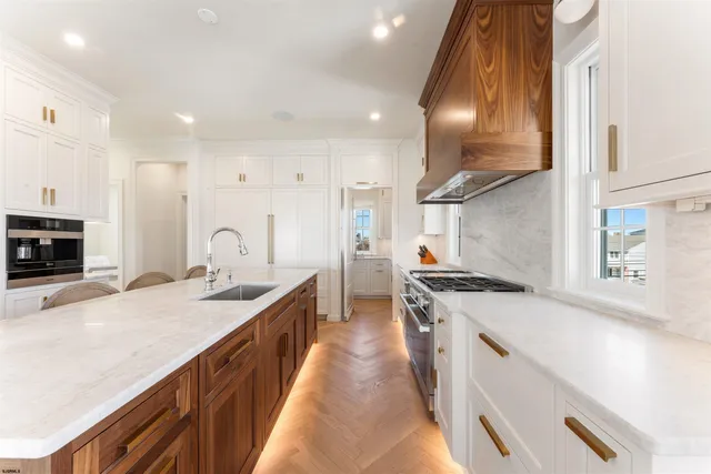 a kitchen with granite countertop a stove and a sink