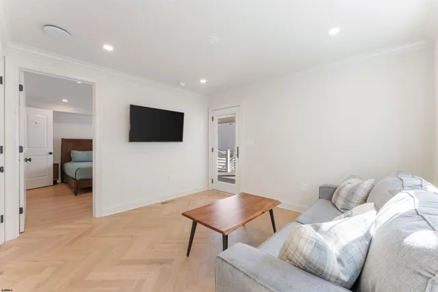 a bedroom with a bed and a television