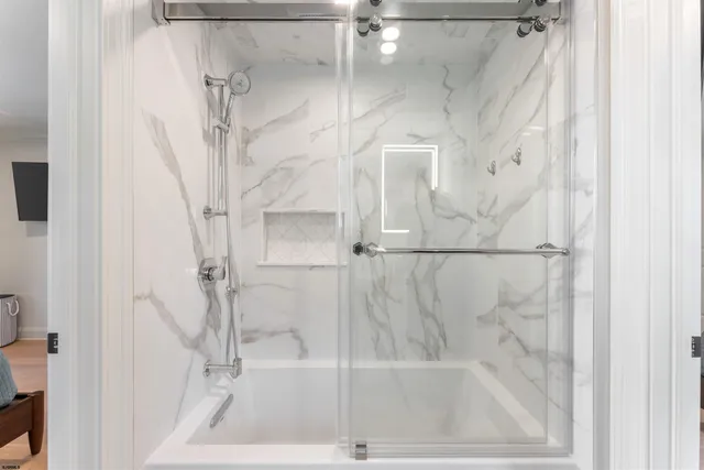 a bedroom with a bed and a television