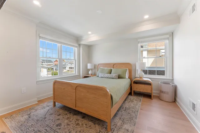 a bathroom with a granite countertop sink mirror vanity and toilet