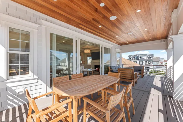 a bedroom with a large bed and a flat screen tv