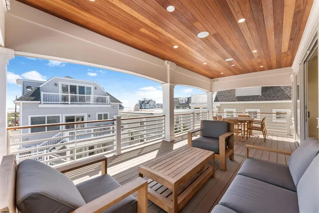 a hallway with cabinets and wooden floor