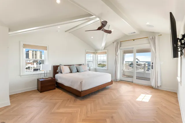 a bathroom with a double vanity sink mirror and shower