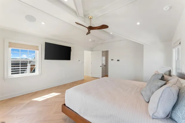 a view of a patio with table and chairs with wooden floor and fence