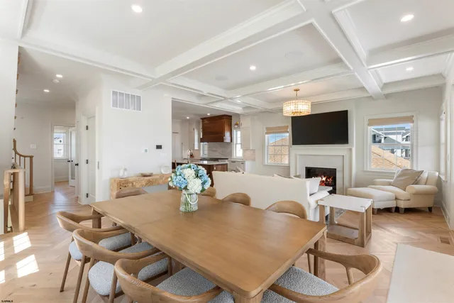 a living room with fireplace furniture and a flat screen tv