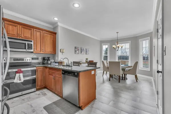 a kitchen with a sink and a refrigerator