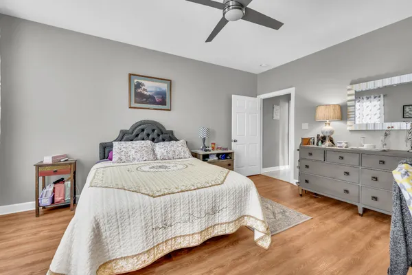 a bedroom with a bed and a dresser