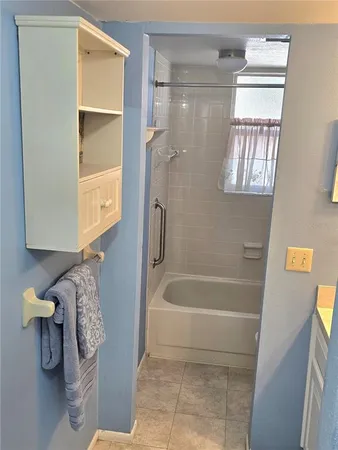 a bathroom with a toilet and a bathtub
