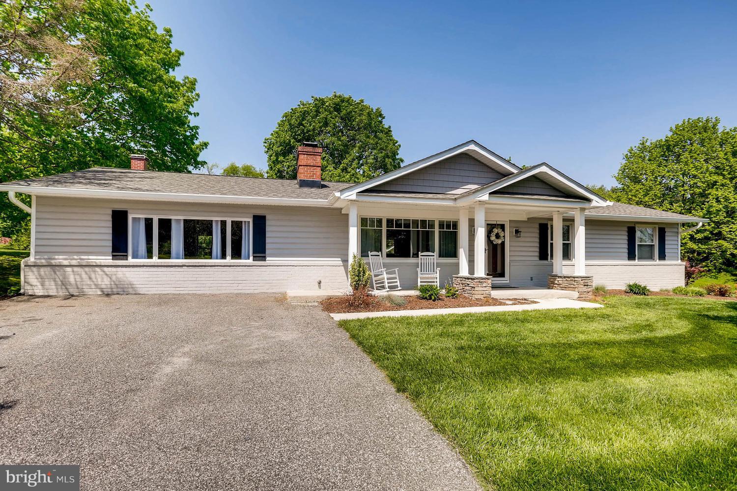 14202 Sunburst Road Baldwin, MD 21013 - Photo 1 of 29 a front view of a house with a garden