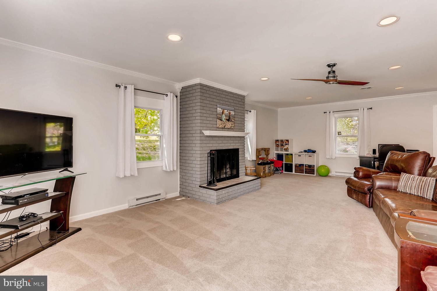 14202 Sunburst Road Baldwin, MD 21013 - Photo 13 of 29 a living room with furniture and a flat screen tv