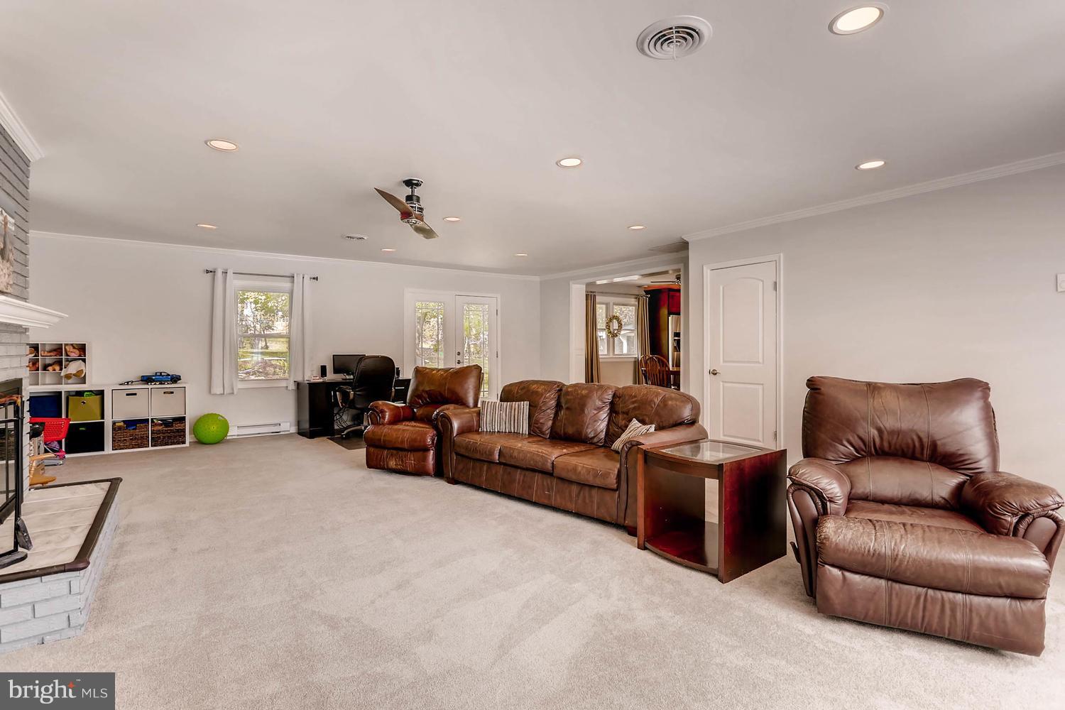 14202 Sunburst Road Baldwin, MD 21013 - Photo 14 of 29 a living room with furniture and a lamp