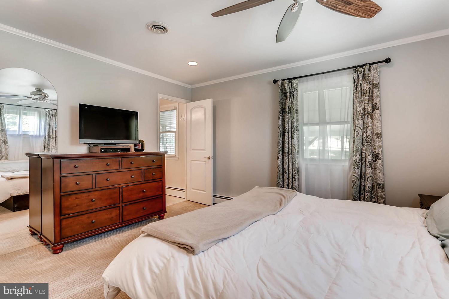 14202 Sunburst Road Baldwin, MD 21013 - Photo 18 of 29 a bedroom with a bed and a flat screen tv