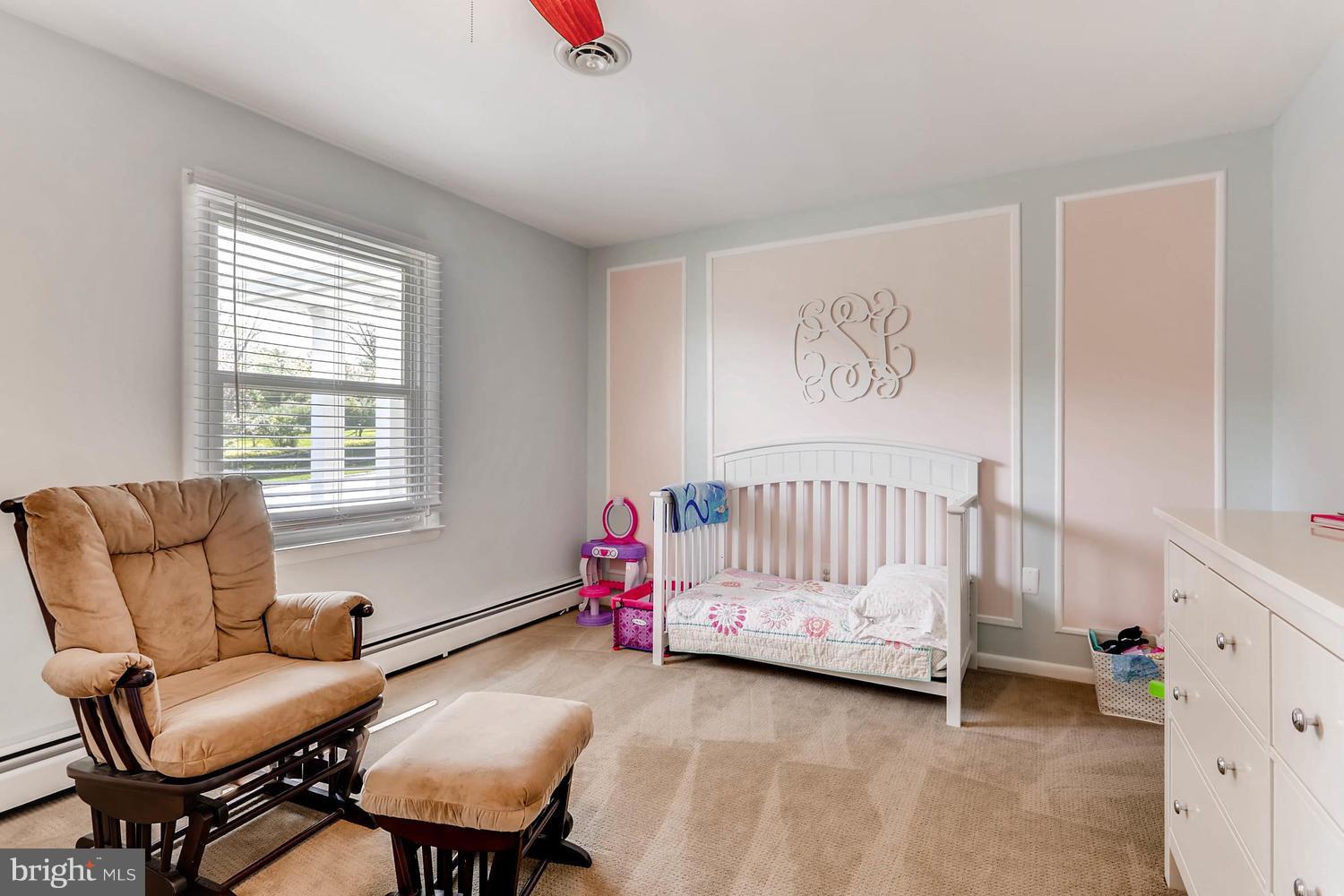 14202 Sunburst Road Baldwin, MD 21013 - Photo 20 of 29 a bedroom with a bed and a couch
