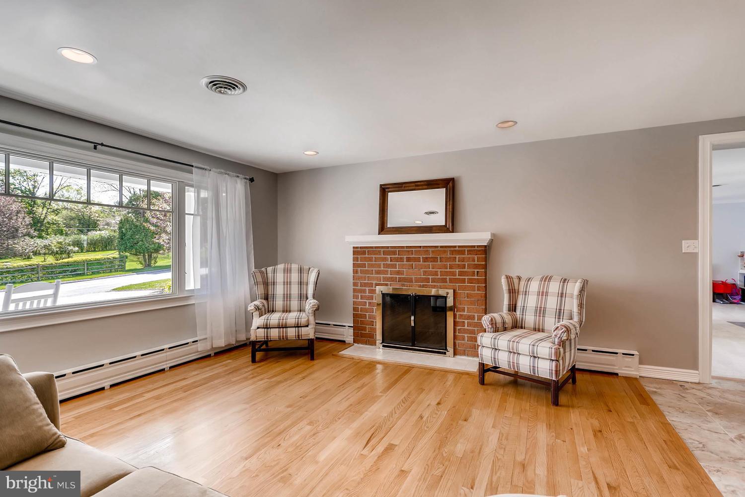14202 Sunburst Road Baldwin, MD 21013 - Photo 5 of 29 a living room with furniture and a fireplace