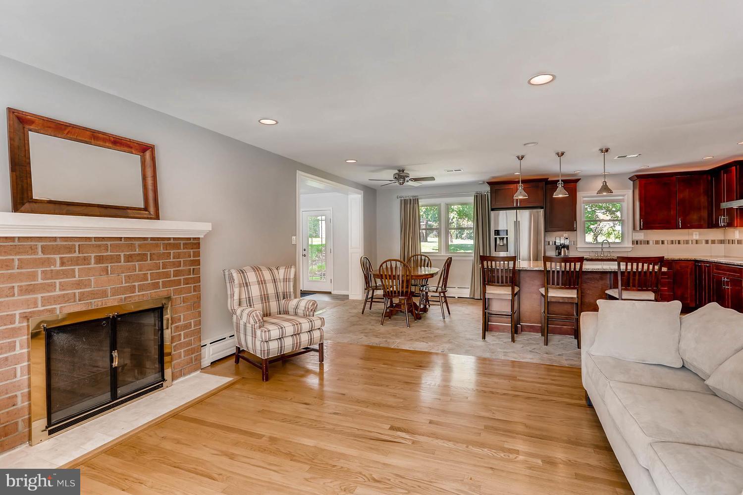 14202 Sunburst Road Baldwin, MD 21013 - Photo 6 of 29 a living room with furniture and a fireplace